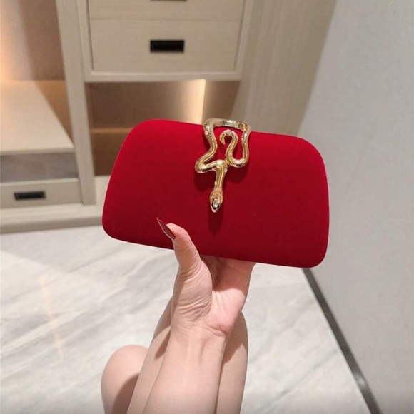 Elegant Red Clutch with Gold Snake Design  Accent
